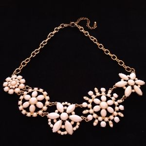 White and gold tone statement necklace